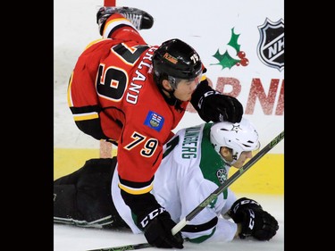 The Calgary Flames' Micheal Ferland flies over the Dallas Stars'  John Klingberg in NHL action on Tuesday December 1, 2015.