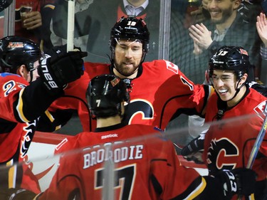 The Calgary Flames' Johnny Gaudreau, right celebrate with teammates after scoreing on the Dallas Stars' Antti Niemi in NHL action on Tuesday December 1, 2015.