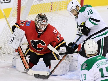 Calgary Flames goaltender Karri Ramo stops this scoring chance by the Dallas Stars' Matt Stajan during NHL action in Calgary on Tuesday December 1, 2015.