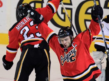 Mark Giordano celebrates with the rest of the Flames after Jiri Hudler scored in the final seconds to tie up the game against the Boston Bruins at the Scotiabank Saddledome on Friday December 4, 2015.