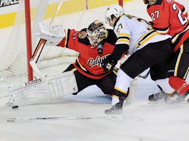 The Calgary Flames Karri Ramo stopped this shot and Patrice Bergeron on a play which generated a Boston Bruins penalty shot late in the third period at the Scotiabank Saddledome on Friday December 4, 2015.