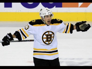 The Boston Bruins' Brad Marchand celebrates after scoring on a penalty shot against the Calgary Flames at the Scotiabank Saddledome on Friday December 4, 2015.