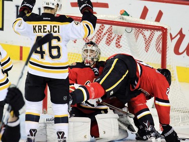 The Boston Bruins' David Krejci celebrates scoring against the Calgary Flames and goaltender Karri Ramo during the second period of NHL action at the Scotiabank Saddledome on Friday December 4, 2015.
