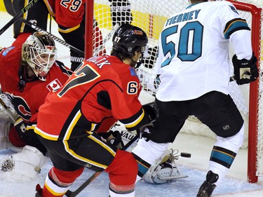 The San Jose Sharks score against Calgary Flames goaltender Karri Ramo during the first period of NHL action at the Scotiabank Saddledome on Tuesday December 8, 2015.