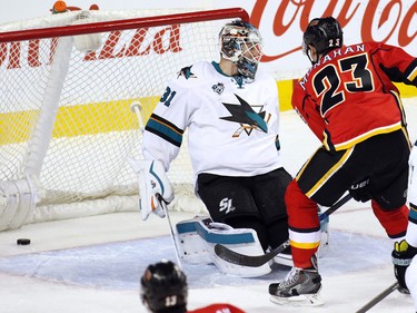 The Calgary Flames' Sean Monahan scores on San Jose Sharks goaltender Martin Jones during the first period of NHL action at the Scotiabank Saddledome on Tuesday December 8, 2015.