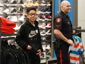 Cst. Brad Bulman and Randy Dung chat as they shop in Marlborough Mall on Wednesday. The Calgary Police Service (CPS) and Marlborough Mall teamed up to bring holiday cheer to well-deserving youth. The 10th annual CopShop event paired CPS officers with local children for a holiday shopping spree. The partnership's goal is  designed to build positive relationships between the police and youth.
