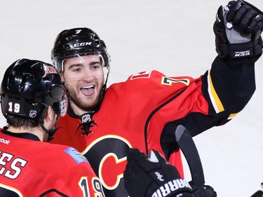 TJ Brodie celebrates scoring the sudden death overtime winning goal against the New York Rangers to win the game 5-4 in Calgary on Saturday December 12, 2015.