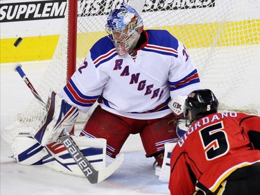 New York Rangers goaltender Antti Raanta watches as Mark Giordano's shot goes past during second period NHL action in Calgary on Saturday December 12, 2015.