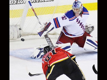 Calgary Flames winger Mason Ramond scores on New York Rangers goaltender Antti Raanta for the go ahead goal in the second period of NHL action in Calgary on Saturday December 12, 2015.