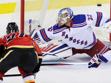 Calgary Flames winger Mason Ramond scores on New York Rangers goaltender Antti Raanta for the go ahead goal in the second period of NHL action in Calgary on Saturday December 12, 2015.