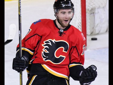 TJ Brodie celebrates scoring the sudden death overtime winning goal against the New York Rangers to win the game 5-4 in Calgary on Saturday December 12, 2015.