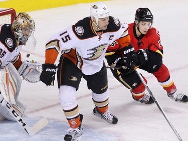 The Anaheim Ducks' Ryan Getzlaf and the Calgary Flames Johnnie Gaudreau battle of position in front of Ducks goalie John Gibson during NHL action at the Scotiabank Saddledome on Tuesday November 29, 2015.