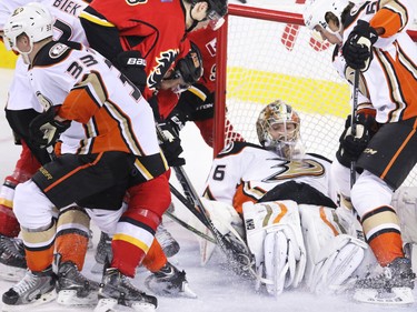 The Calgary Flames try to score on Anaheim Ducks goalie John Gibson during the final minutes of NHL action at the Scotiabank Saddledome on Tuesday November 29, 2015. The Ducks won the game 1- 0.