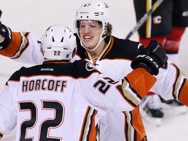 Anaheim Ducks' Shawn Horcoff and Rickard Rakell celebrate scoring on the Calgary Flames during NHL action at the Scotiabank Saddledome on Tuesday November 29, 2015.