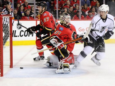 The Los Angeles Kings Nick Shore watches as Marian Gaborik's shot goes past Calgary Flames goaltender Karri Ramo during NHL action at the Scotiabank Saddledome on New Year's Eve December 31, 2015.