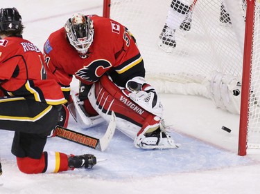 The Los Angeles Kings score on Calgary Flames goaltender Karri Ramo during NHL action at the Scotiabank Saddledome on New Year's Eve December
