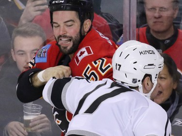 The Los Angeles Kings Milan Lucic fights with the Flames' Brandon Bollig during NHL action at the Scotiabank Saddledome on New Year's Eve December 31, 2015.