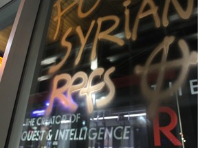 Obscene anti-Syrian refugee grafitti on a window at the Tuscany LRT station Thursday night Dec. 3, 2015.The slogans were spray painted on windows, walls, trains and parked cars in the vicinity.
