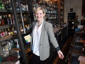 Sarah Ward shows off the decor at Proof cocktail lounge on 1st Street Sw, one of the various restaurants around town she has designed.