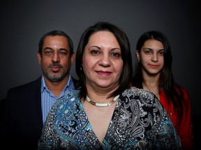 Aseel Jawad, centre, with husband Monjed Al-Bassri and daughter Rafal Al-Bassri, have built a new life from scratch after fleeing wartorn Iraq for Calgary in 2010.