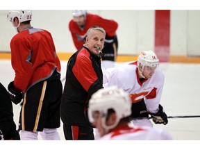 Head coach Bob Hartley runs a drill as the Calgary Flames practiced at the Corral on Dec. 14, 2015.