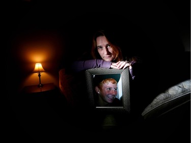 Lianne Sander with a photo of her son Keegan Kostiuk in his room on December 15, 2015. Kostiuk died from a fentanyl overdose at the age of 18.