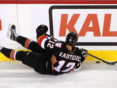 Hitmen centre Mark Kastelic tries to control the puck as the Calgary Hitmen hosted the Medicine Hat Tigers in Western Hockey League action at the Saddledome on Saturday, December 19, 2015.