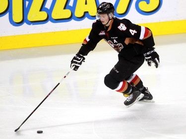 Micheal Zipp moves the puck down the ice as the Calgary Hitmen hosted the Medicine Hat Tigers in Western Hockey League action at the Saddledome on Saturday, December 19, 2015.