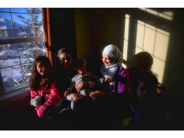 Nour, a Syrian refugee, enjoys their new home in Calgary with her four children.