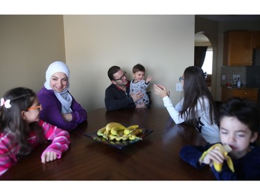 Syrian refugees Nour and her husband Asiad enjoy a new home in Calgary with their four children.