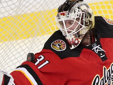 Calgary Flames goalie Karri Ramo makes a save during their game against the Winnipeg Jets  at the Scotiabank Saddledome in Calgary on December 22, 2015.