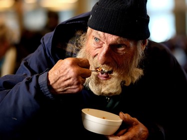 Rull Doble, 75, enjoys a slice of pumpkin pie during the Christmas feast at the Calgary Drop-In and Rehab Centre on December 25, 2015.
