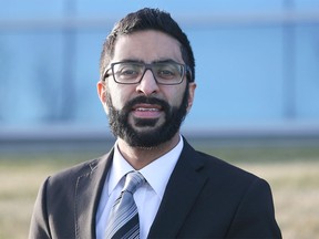 Naheed Gilani poses for a photo outside his office in Calgary Monday, Dec. 7, 2015. Gilani is part of a group of five who are sponsoring a Syrian family.