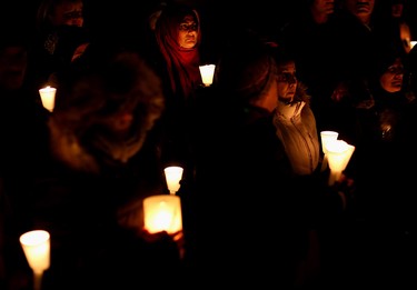 Humera Abbas and others from the Muslim community take part in a candlelight Vigil organized by the Canadian Muslim community in Calgary.