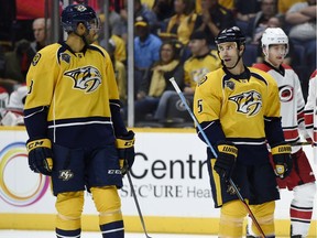 Nashville Predators defensive partners Seth Jones, left, and Barret Jackman talk during an October game against Carolina. Jackman, who was mentored by Al MacInnis on the St. Louis Blues when he was Jones' age, is happy to reciprocate with the talented youngster.