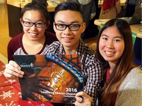 Jessica Ang, 17, Chris Hoang, 16, and Michelle Vuong, 15 are selling their 2016 Celebrating Alberta's Diversity Charity Calendars for $10 at Staples stores and other locations, with all the profits going to their "Be the Change"  in Calgary on December 21, 2015.