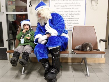 WestJet's Blue Santa sat with five-year-old Daniel Studney after arriving in Yellowknife, NT on December 9, 2015 as he made his way across the country for WestJets Mini Miracle Day. He started the morning in Halifax and finished in Vancouver with stops in Toronto and Yellowknife. At the airport, Blue Santa gave Studney's family a trip anywhere Westjet flies.