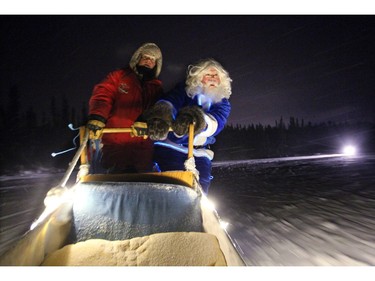 WestJet's Blue Santa took a side excursion to do a little dog sledding with Becks Kennels employee Kaylee Youngdahl in Yellowknife, NT on December 9, 2015 prior to making a special present drop off of new toys, food, treats, beds and toys for the dogs at Beck's Sled Dog Kennels & Tours. WestJet's Blue Santa made his way across the country for WestJets Mini Miracle Day. He started the morning in Halifax and finished in Vancouver with stops in Toronto and Yellowknife.