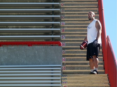 Injured Calgary Stampeders running back Jon Cornish stopped for a moment to watch the plays as he ran up the stairs of McMahon Stadium on September 9, 2015. The team was on the field practicing for the Saturday match against the Eskimos.