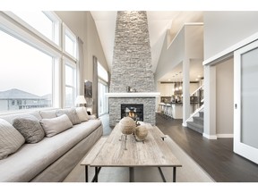 A full-height stone fireplace in the Roxbury in Chestermere.