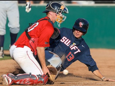 Swift Current Indians infielder Justin Esquerra slides safely into home at Seaman Stadium in Okotoks on Wednesday, July 22, 2015.