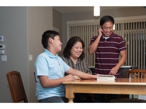 Renato, Liezel and E.J. Damaso in the kitchen of their new townhome at Arrive at Evanston.