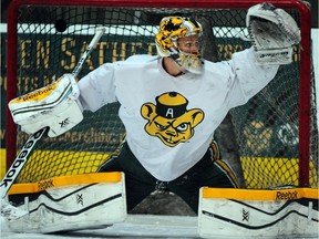 University of Alberta goalie Luke Siemens made a whirlwind trip to Calgary to practise on Thursday morning with the Calgary Flames, filling in for a sick Jonas Hiller.