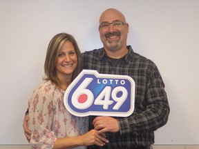 Christian and Monique Etienne pose for a photo in this recent handout photo. The Airdrie, Alta., won $14,519,825 on the December 12 Lotto 6-49 draw.