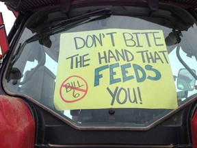 Farmers and ranchers show their opinions on the proposed Alberta governmentt's Bill 6 during a convoy and protest in Okotoks, Alberta, south of Calgary, Alta on Wednesday December 2, 2015. Jim Wells/Calgary Sun/Postmedia Network