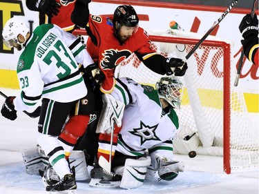 The Calgary Flames' David Jones celebrates as Johnny Gaudreau's shot goes past the Dallas Stars' Antti Niemi in NHL action on Tuesday December 1, 2015. The Flames won the game 4-3 in a shoot out.