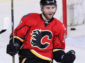 Flames defenceman TJ Brodie, seen celebrating scoring the sudden death overtime winning goal against the New York Rangers to win Saturday's game, has been the driving force behind the team's defensive turnaround.