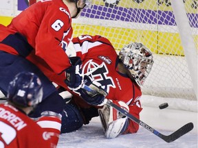 Calgary Hitmen Jakob Stukel's shot goes past Lethbridge Hurricanes goaltender Jayden Sittler during WHL action at the Scotiabank Saddledome on Wednesday, Dec. 30, 2015.