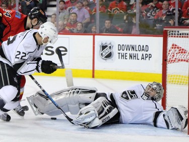 The The Los Angeles Kings' Jonathan Quick goes down  during a Calgary Flames scoring chance in NHL action at the Scotiabank Saddledome on New Year's Eve December 31, 2015.