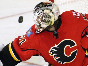 Calgary Flames goaltender Karri Ramo eye to eye with the puck in the third period.